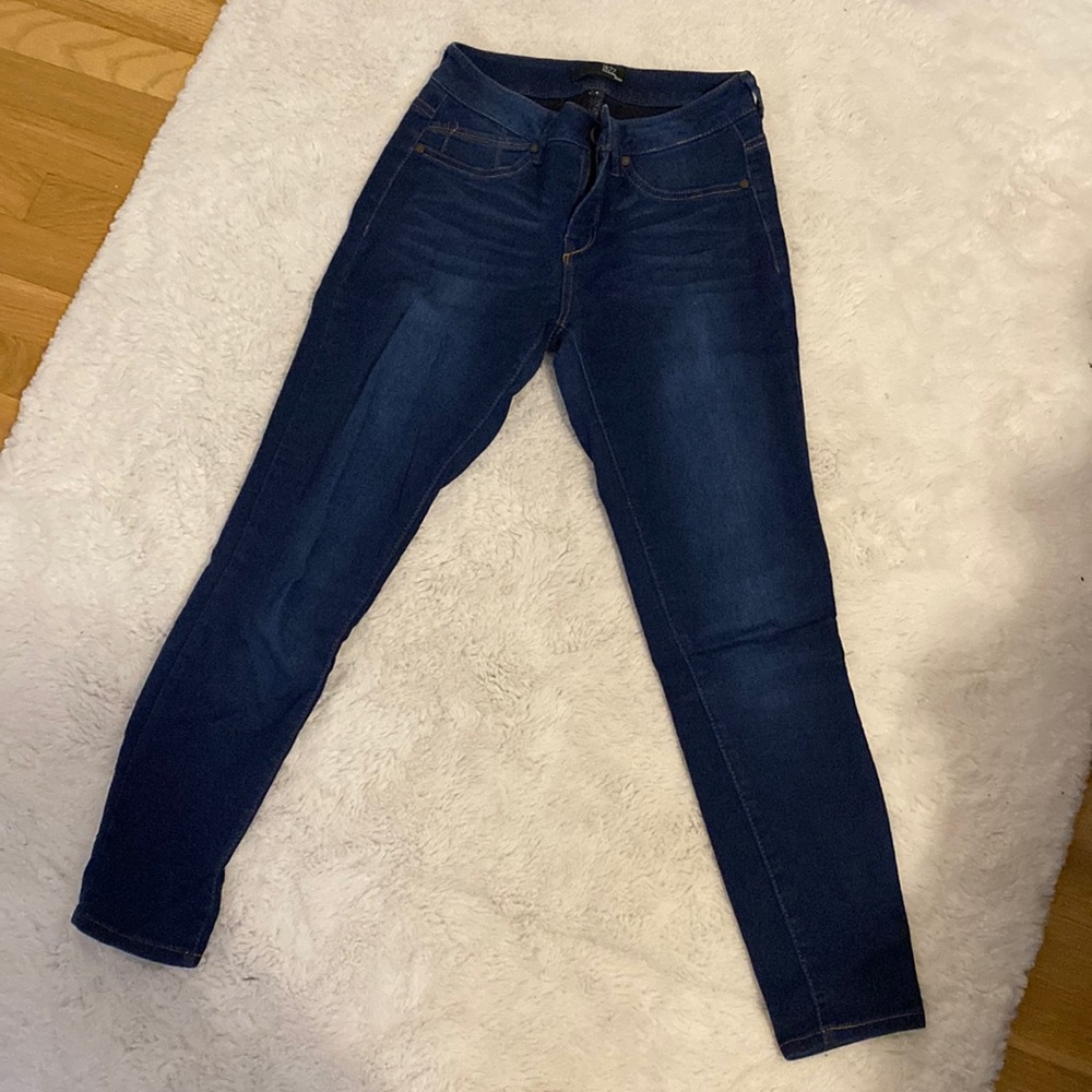 Stretchy, mid-rise, dark wash jeans.